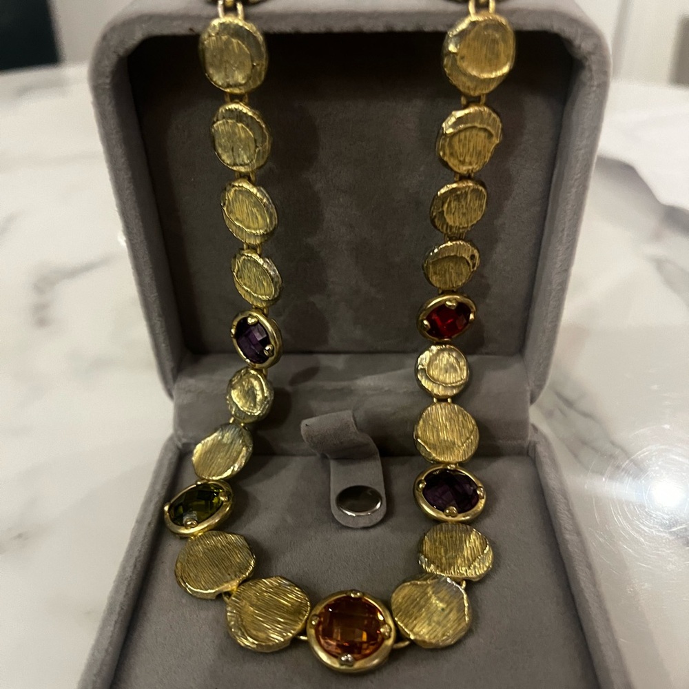 Gold colored necklace with multicolored stones